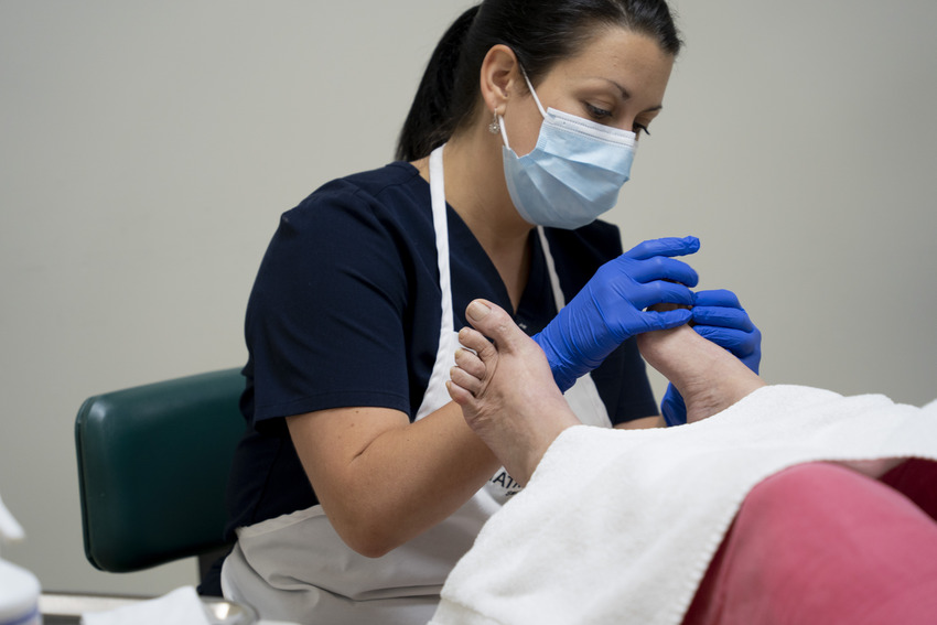 Nurse working on a foot